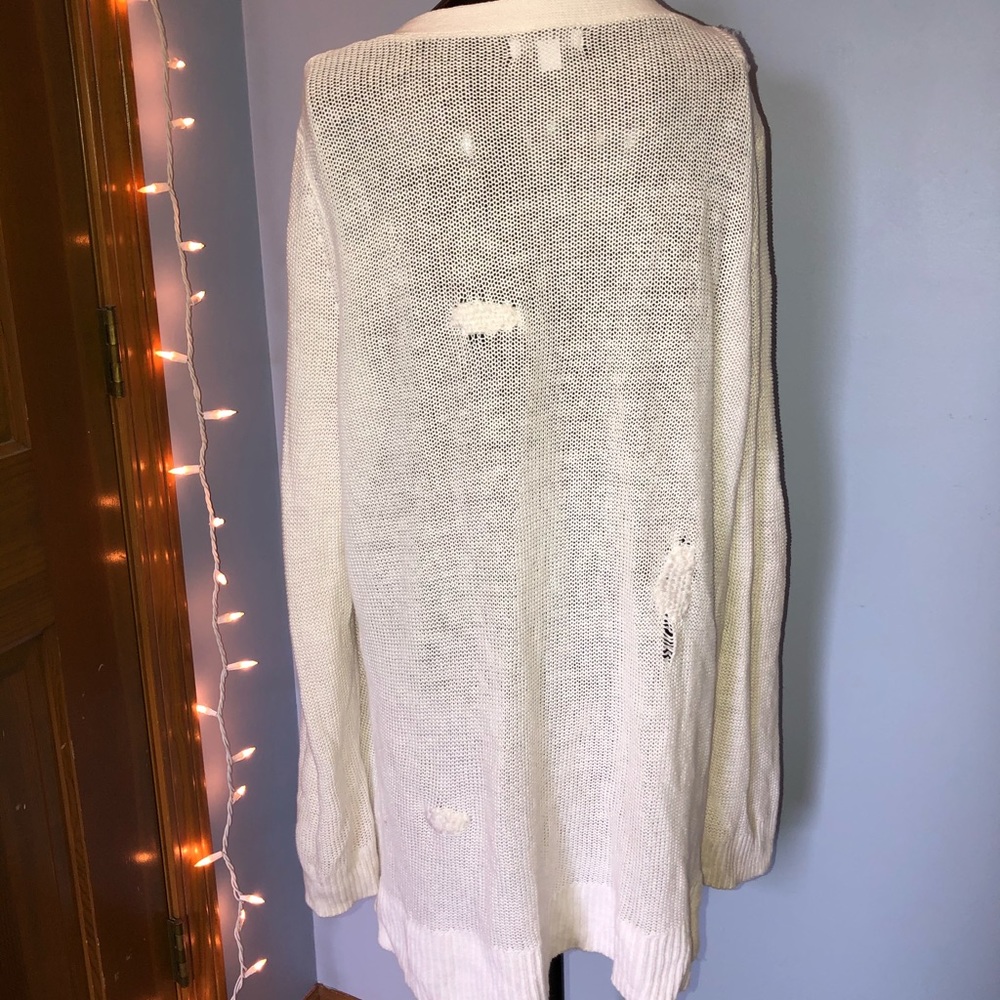white Gap sweater with patches on the back